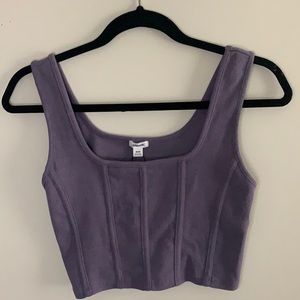 A purple corset-style crop top